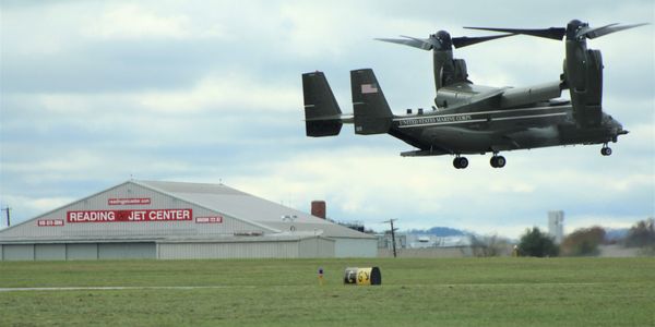 United States Marine Corps aircraft flies in front of Reading Jet Center.