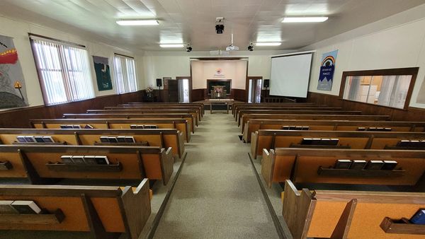 Midvale Church of Christ Pews with Hymnals in the back pockets