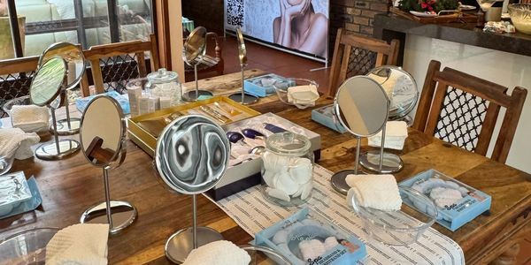 An actual skincare party setup, equipment provided by opulent aura, mirrors, bowls, pamper sets, etc