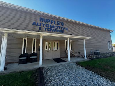 Exterior of Rupple's Automotive & Towing with chairs on the porch.