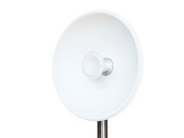 Large white parabolic satellite antenna.
