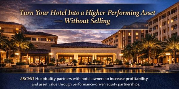 Hotel exterior at dusk promoting asset performance enhancement without selling.