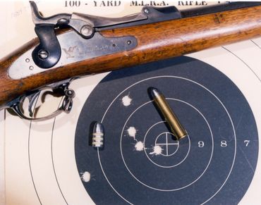 45-70 Springfield rifle, cartridge and target