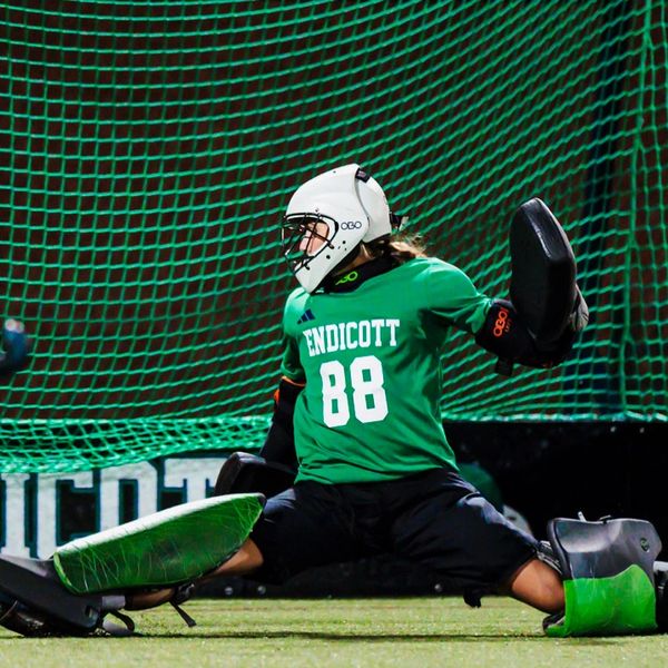 Faith making a save during her freshman year at Endicott.