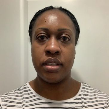 Portrait of a woman in a striped shirt.