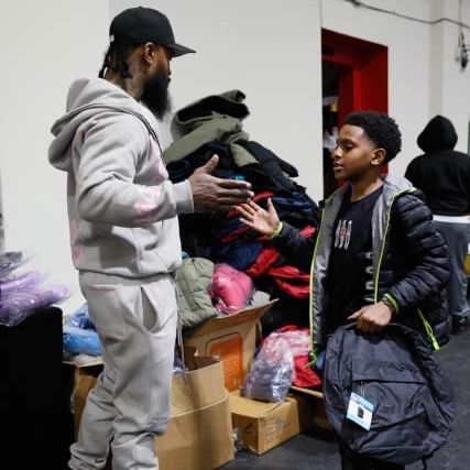 Coat giveaway to community kids.