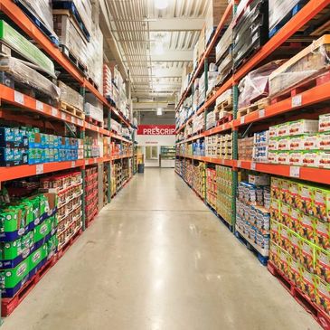 Aisle in a warehouse store stocked with bulk goods.