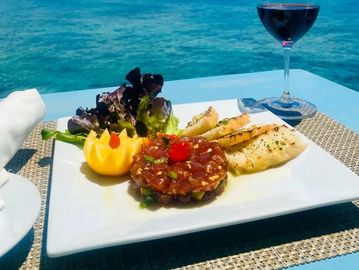 Tuna seasoned with soy, ginger, sesame oil and green onions.