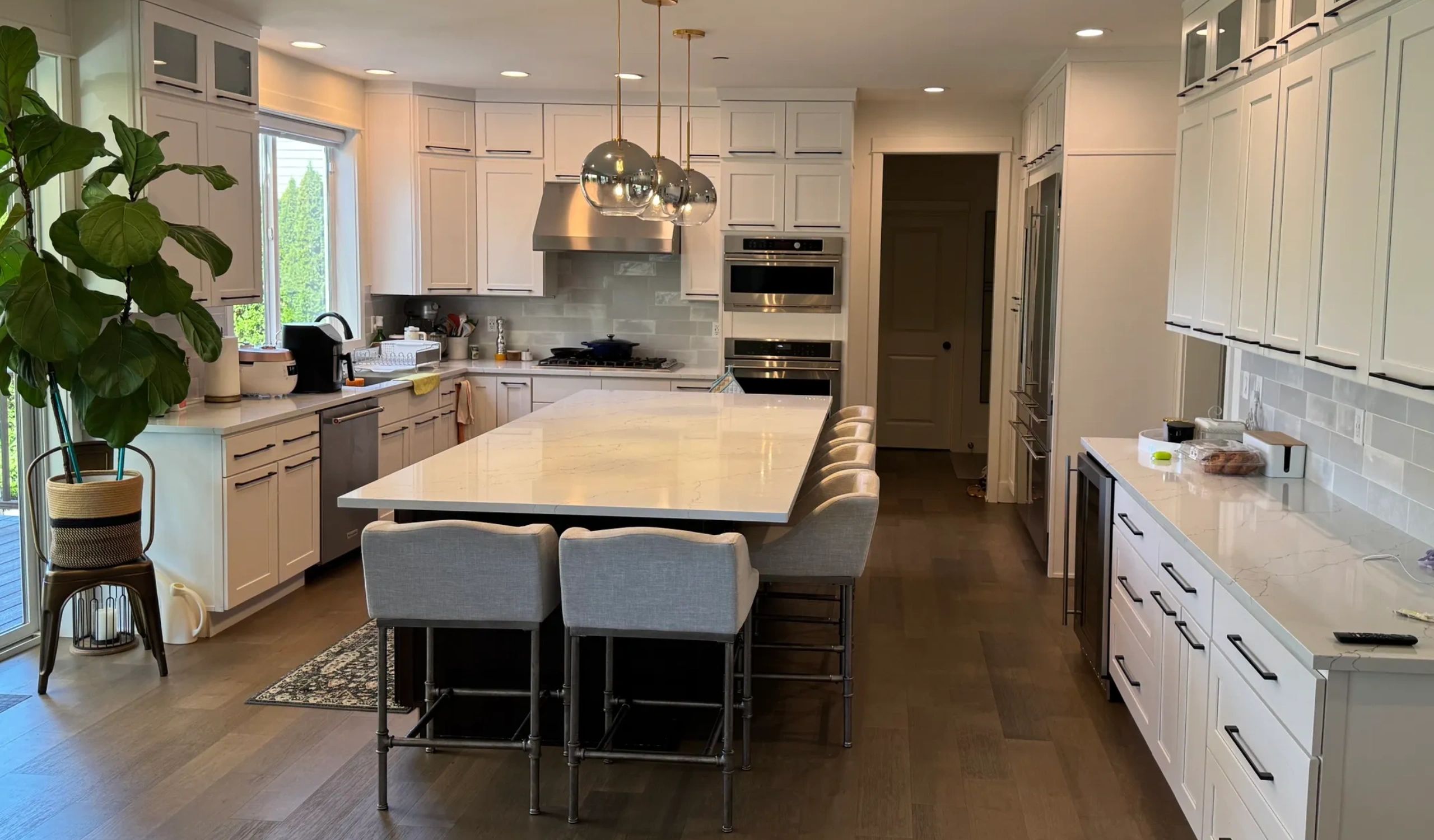 Kitchen remodel with luxury finishes and cabinets, tile backsplash and nice lighting