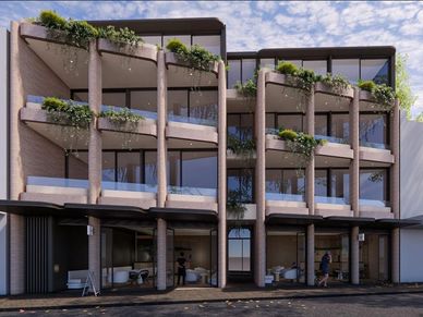 Modern apartment building with greenery on balconies and large windows.