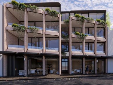 Modern building with plants on balconies and large glass windows.
