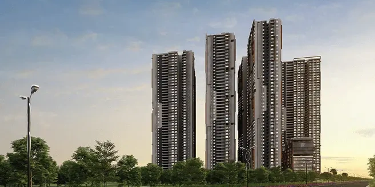 Tall modern skyscrapers with trees and streetlights.