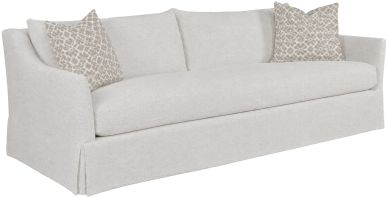 Light gray sofa with patterned cushions.