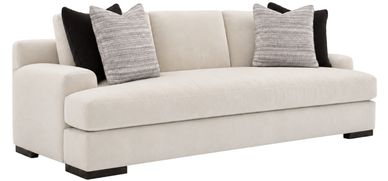Modern beige sofa with black and gray pillows.