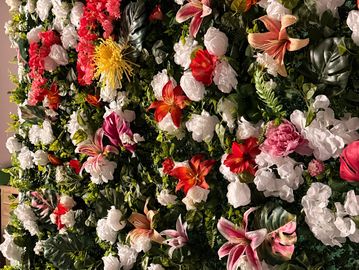Vibrant floral wall with diverse flowers.