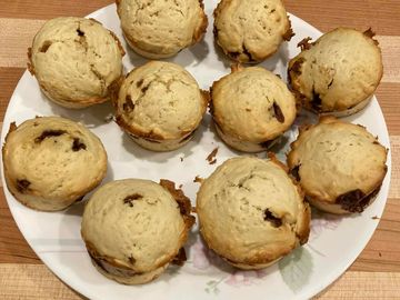 Plate of freshly baked chocolate chip muffins.