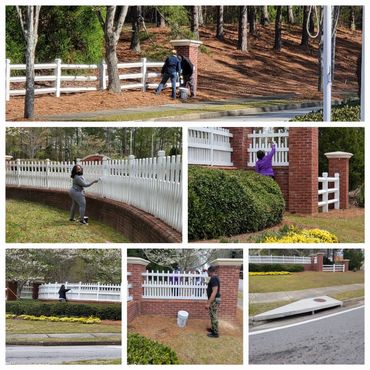 Neighbors assisting with fence paint .