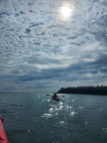 Person kayaking on a beautiful day