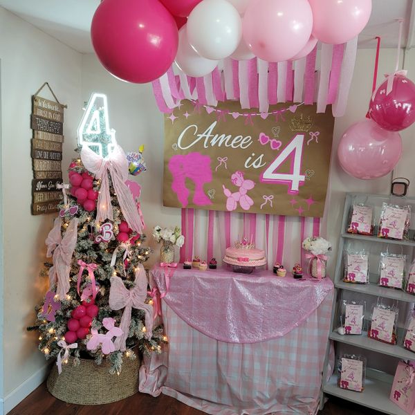 Pink-themed birthday party setup celebrating Amee's 4th birthday with balloons, cake, and decorations.