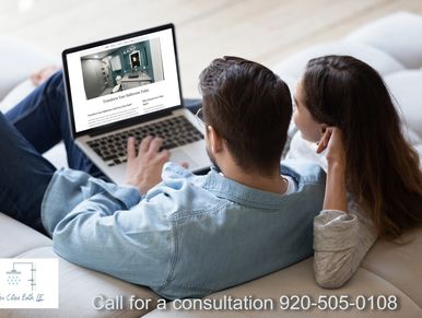 A couple looking at Fox Cities bath website 