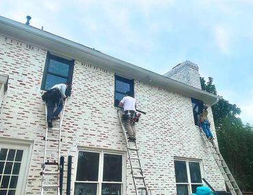 WindowMax Install Team on ladders working to complete installation of customer windows