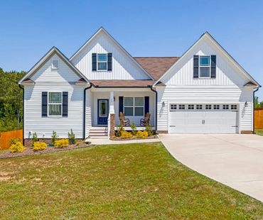 exterior of white home with new windows and door from WindowMax