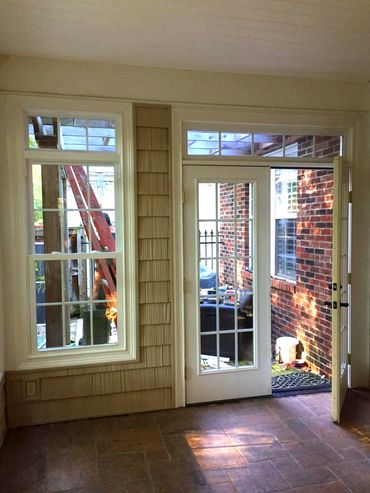 Interior view of patio where french doors and windows with transoms were installed by WindowMax