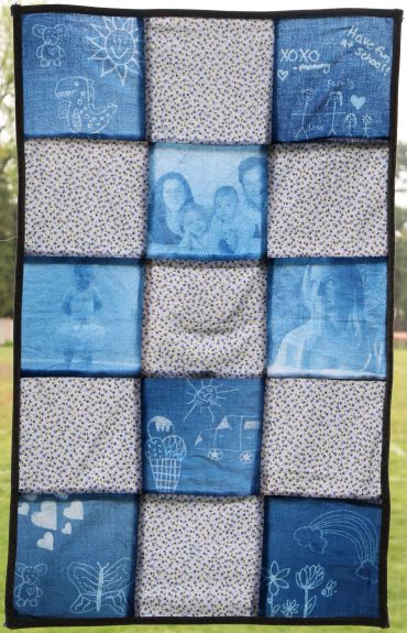 Patchwork quilt with photos and drawings.