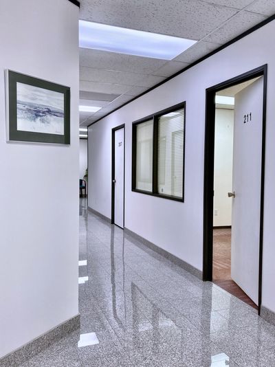 Clean, well-maintained granite flooring hallway at office Centre. Offices for rent in SE Calgary 