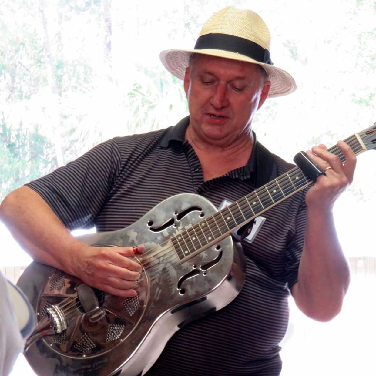 Bearded man performing acoustic guitar session