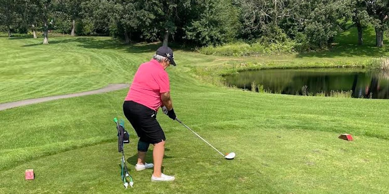 Teeing up a ball with HHGR golf aids