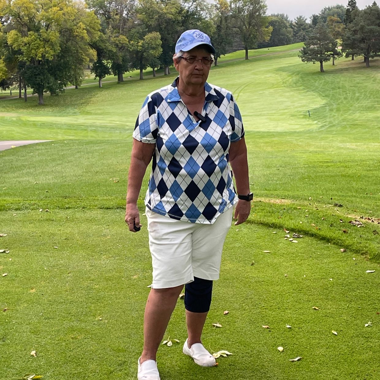 Picture of Jo Boettcher Founder of Helping Hands Golf Resources wearing backbrace and knee brace