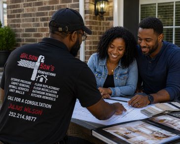 Contractor consulting with a couple over renovation plans.