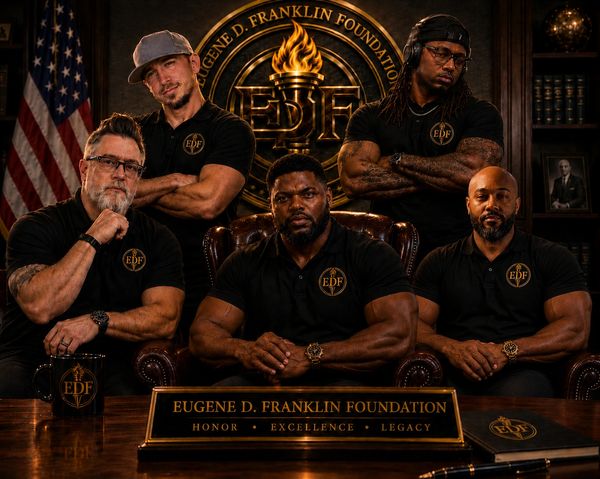Five men in black shirts posing under Eugene D. Franklin Foundation sign.