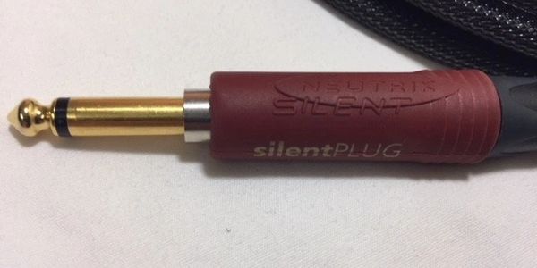 Close up of silent straight gold plug