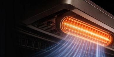 Close-up of an air conditioner heating element with warm air flowing.