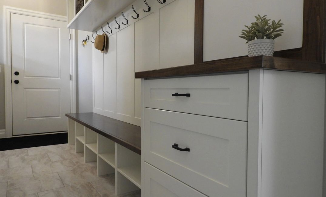 Mudroom built in with cubby storage, bench seat, shoe shelves, drawer storage & dry erase board.