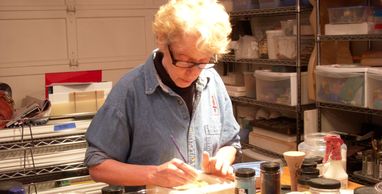 Ana working on her open face glass tiles during a private lesson at Striking Art.