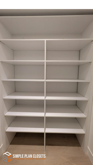 White wooden shelving unit with multiple compartments in a closet.
closet designs
custom closets
organized spaces
custom pantry solutions
laundry room designs
reach-in closets
walk-in closets