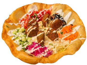 Crispy falafel wrap loaded with fresh salads, tahini and pickles. Authentic Israeli street food.