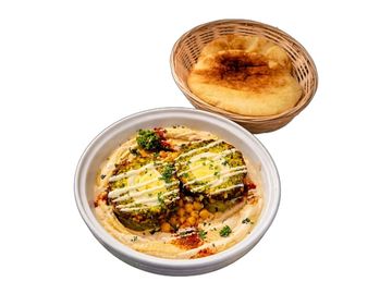 Falafel hummus combo with warm Israeli pita, chickpeas, tahini and falafel stuffed with boiled egg.
