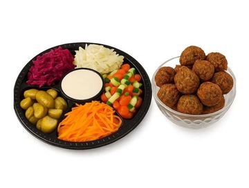 Falafel feast platter with fresh salads, pickles, tahini sauce, and 12 crispy falafel – and tasty.