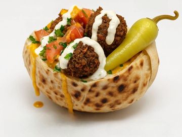 Crispy falafel, fresh veggies, creamy sauces in a half pita-perfect size, full flavor bite!