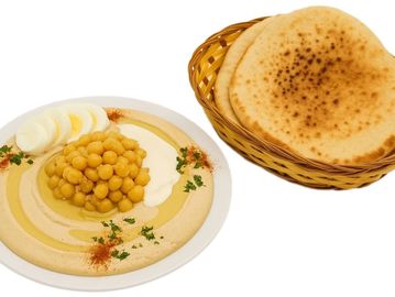Middle Eastern hummus with chickpeas, egg, tahini & pita—authentic, fresh, and full of flavor