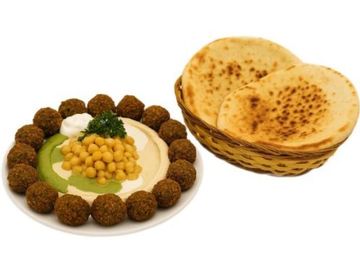 Hummus bowl topped with chickpeas, 18 falafel balls, herbs, and two pocket pita bread 