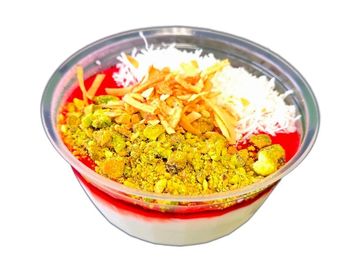 Creamy Mallabibi with rose jelly, coconut & nuts. Gluten-free, fresh daily at The Green Falafel.