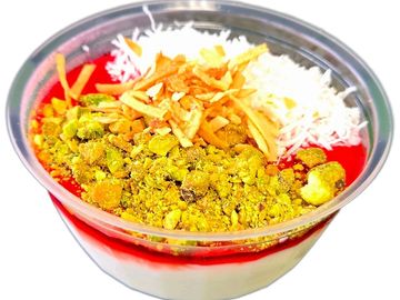 Creamy Muhallebi with rose jelly, coconut & nuts. Gluten-free, fresh daily at The Green Falafel.