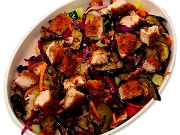 Crispy schnitzel bowl combo with fresh veggies plus fries and drink. A flavour Mediterranean meal.