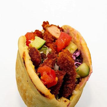 Half-size schnitzel pita packed with fresh crunch and flavor. Perfect light, satisfying option.