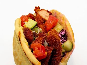 Crispy schnitzel pita combo with fries, salad, or soup plus a drink — full flavor, great value!